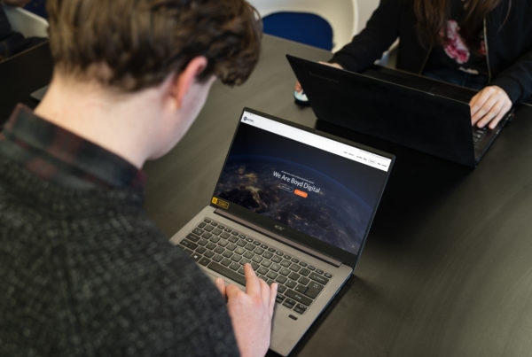 Man looking at a Boyd Digital site on laptop